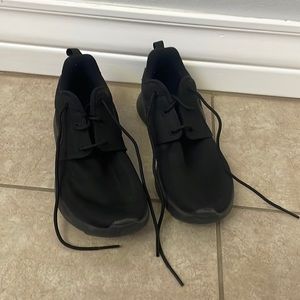 These are black Nike shoes